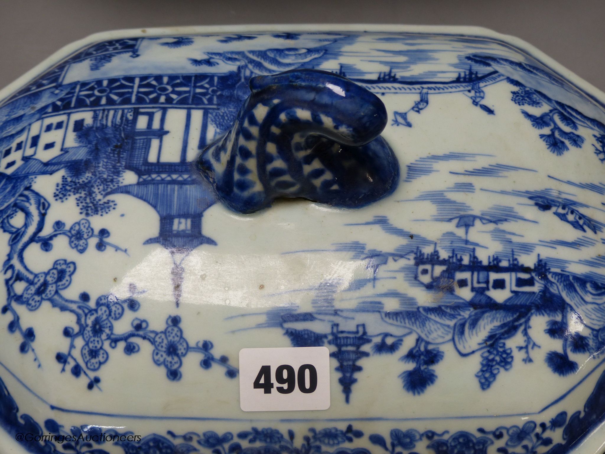 An 18th century Chinese export blue and white porcelain tureen and cover, 24cm high, 30cm wide.